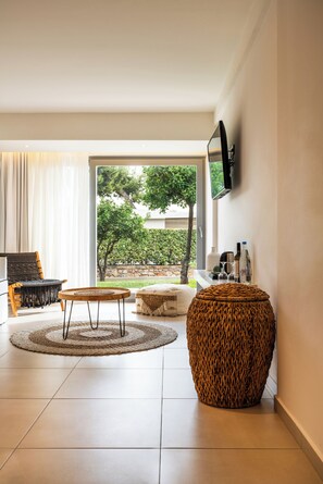 Premium Bungalow Suite with Garden View | Living room | 42-inch TV with satellite channels - Amaronda Resort & Spa (Eretria)