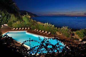 Seasonal outdoor pool, open 8:30 AM to 8:00 PM, pool umbrellas