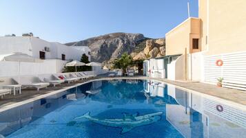 Outdoor pool, pool umbrellas, sun loungers