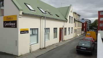 A building with a sign indicating it is a guesthouse.