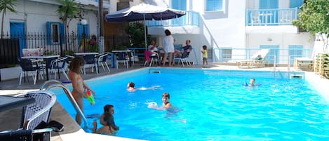 Seasonal outdoor pool, pool umbrellas, pool loungers