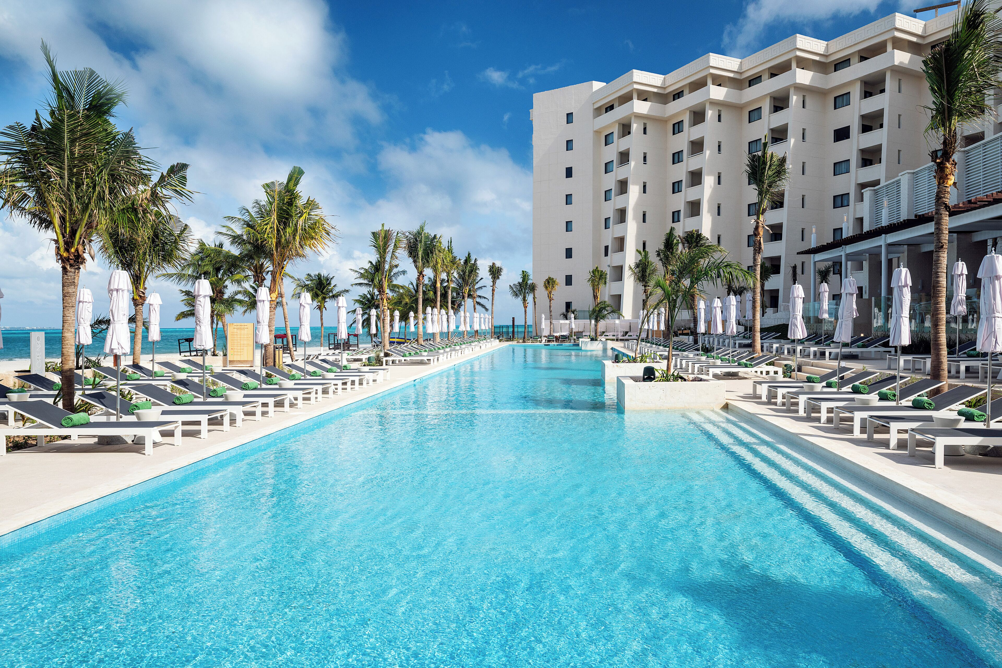 2 outdoor pools, open 8:00 AM to 8:00 PM, pool umbrellas