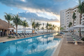 2 outdoor pools, open 8:00 AM to 8:00 PM, pool umbrellas