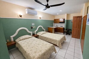 Junior Studio Suite, 2 Twin Beds, Kitchenette | Minibar, individually decorated, individually furnished