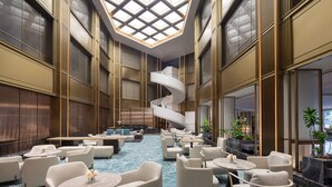 A spacious lobby with a central spiral staircase, multiple seating areas, and large windows allowing natural light. - Wyndham Hangzhou Linping (Hangzhou)