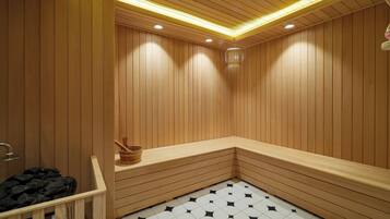 A sauna room with wooden walls and benches, a tiled floor, and a wooden bucket.