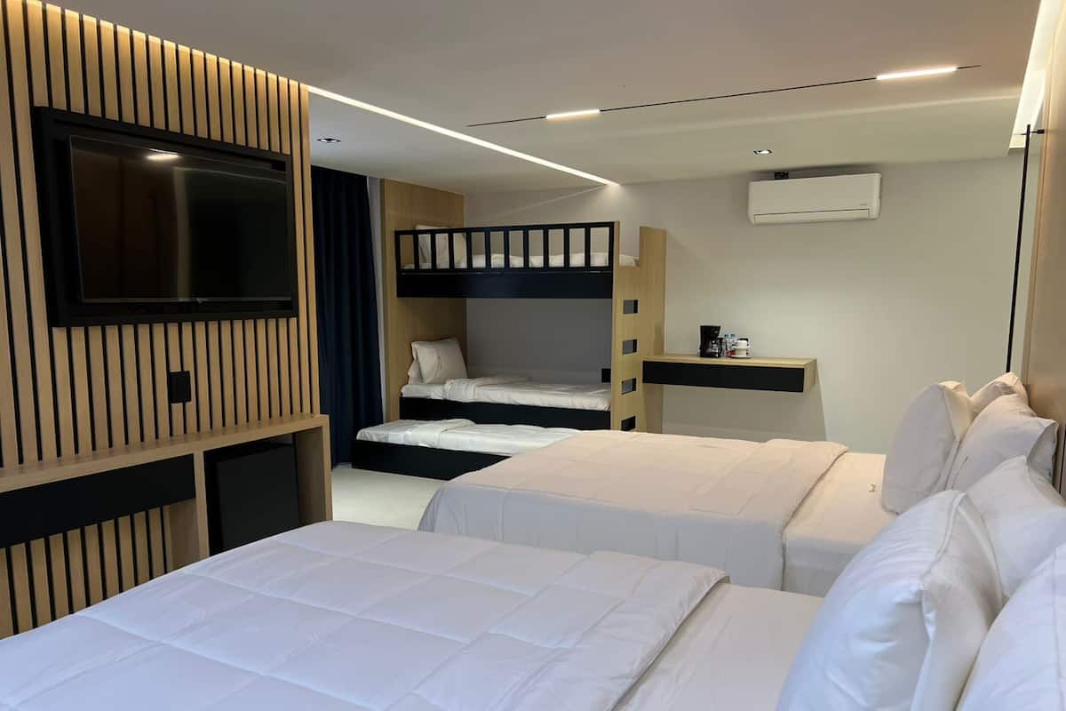 Family Room | In-room safe, desk, laptop workspace, blackout drapes