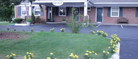 A small building with a sign that reads "OFFICE" on the front.