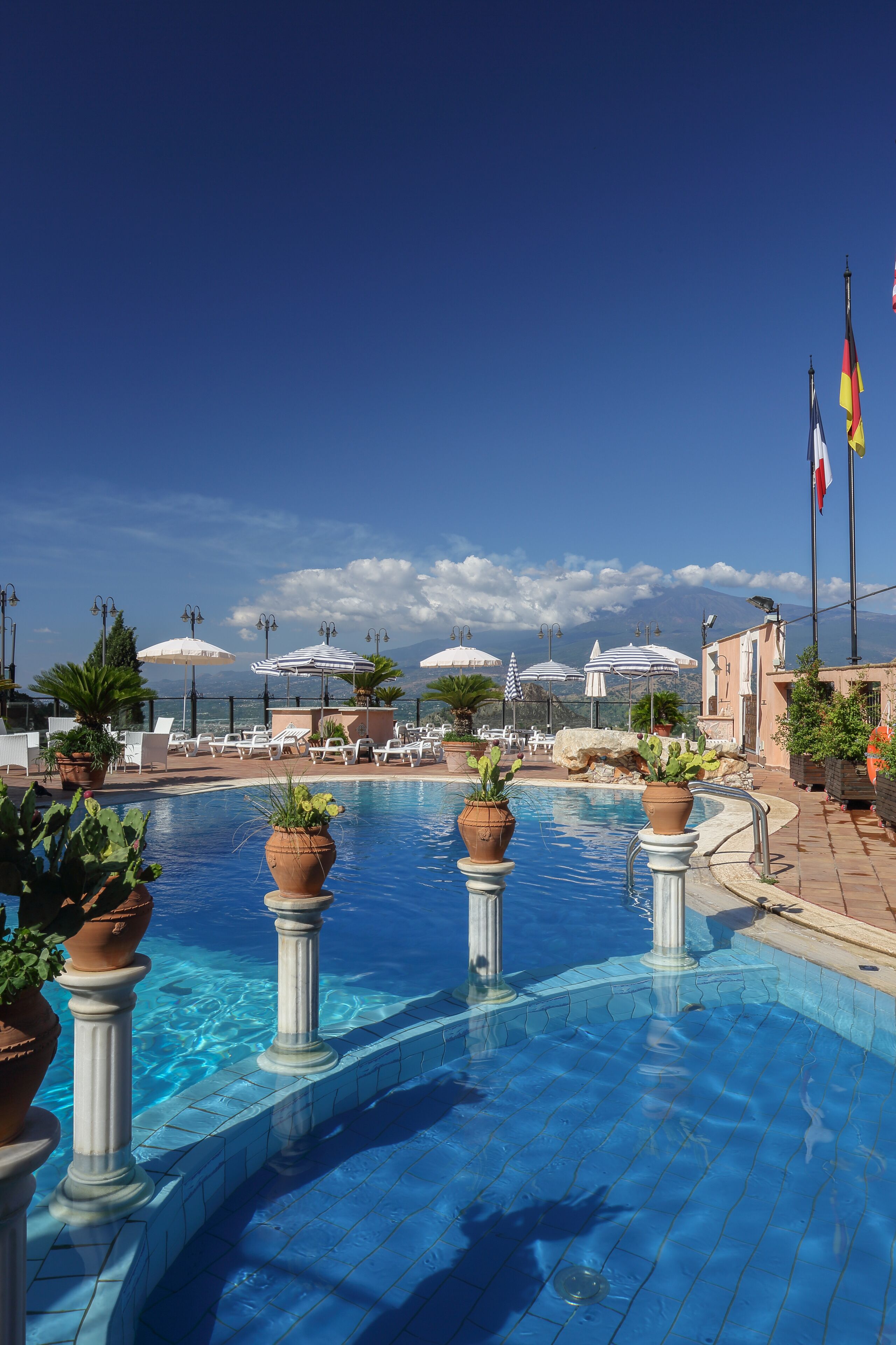 seasonal outdoor pool, open 9:30 am to 7:30 pm, pool umbrellas