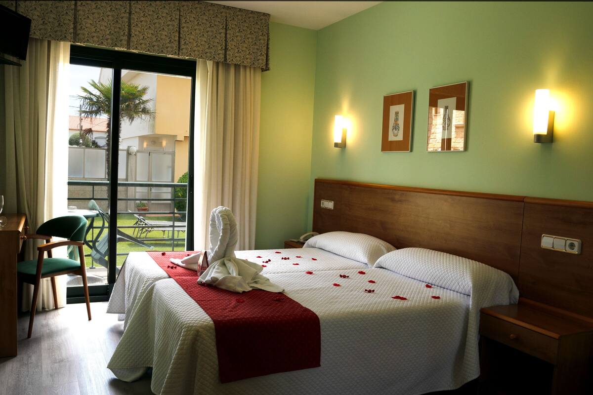 standard room, multiple beds, pool view | in-room safe, desk, laptop workspace, blackout curtains