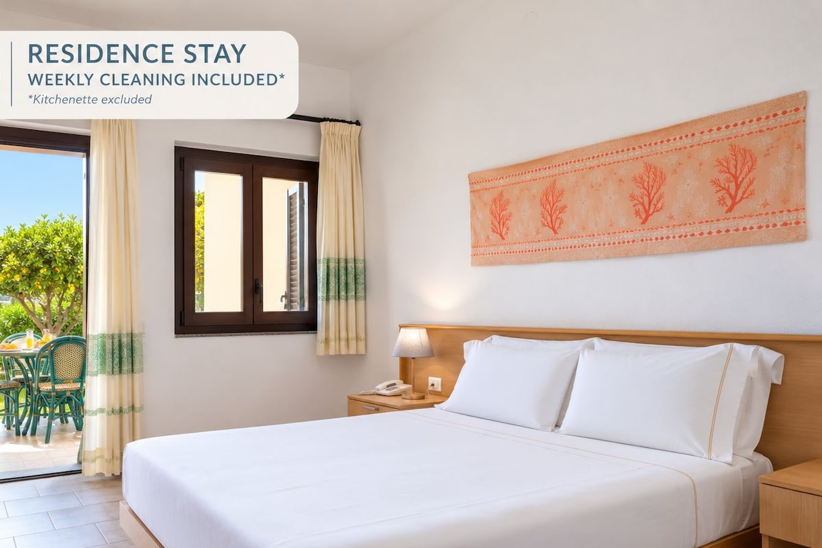 Appartamento Piano Terra con Giardino | Down comforters, minibar, in-room safe, blackout drapes