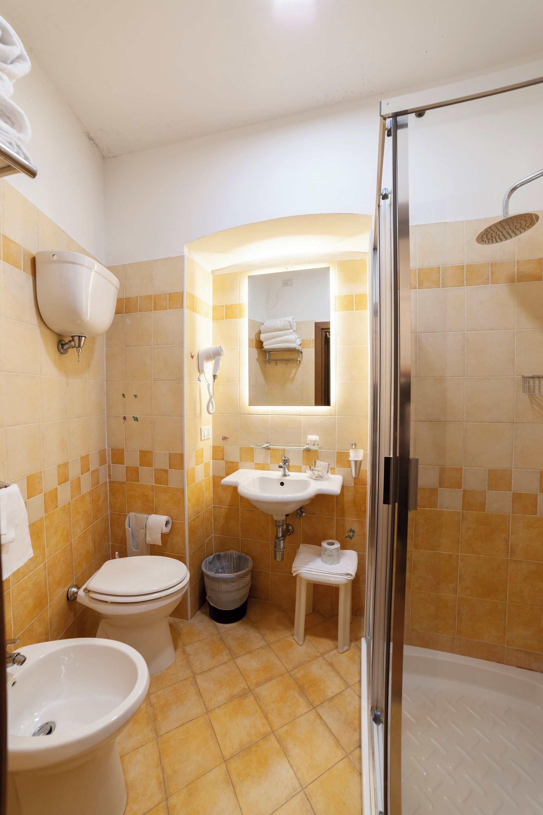 standard quadruple room | bathroom | shower, hair dryer, bidet, towels