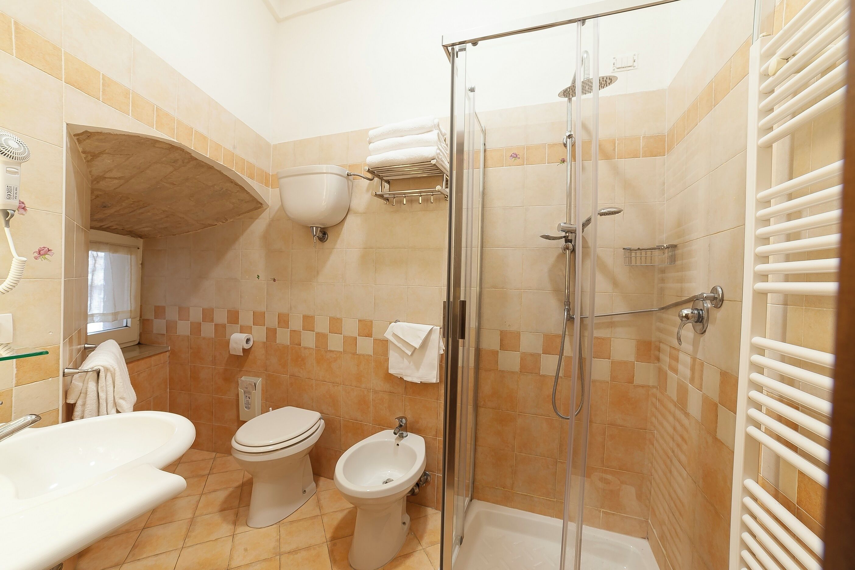 superior quadruple room | bathroom | shower, hair dryer, bidet, towels