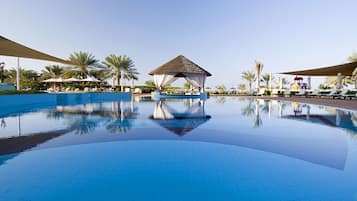 Outdoor pool, open 8:00 AM to 8:00 PM, free cabanas, pool umbrellas