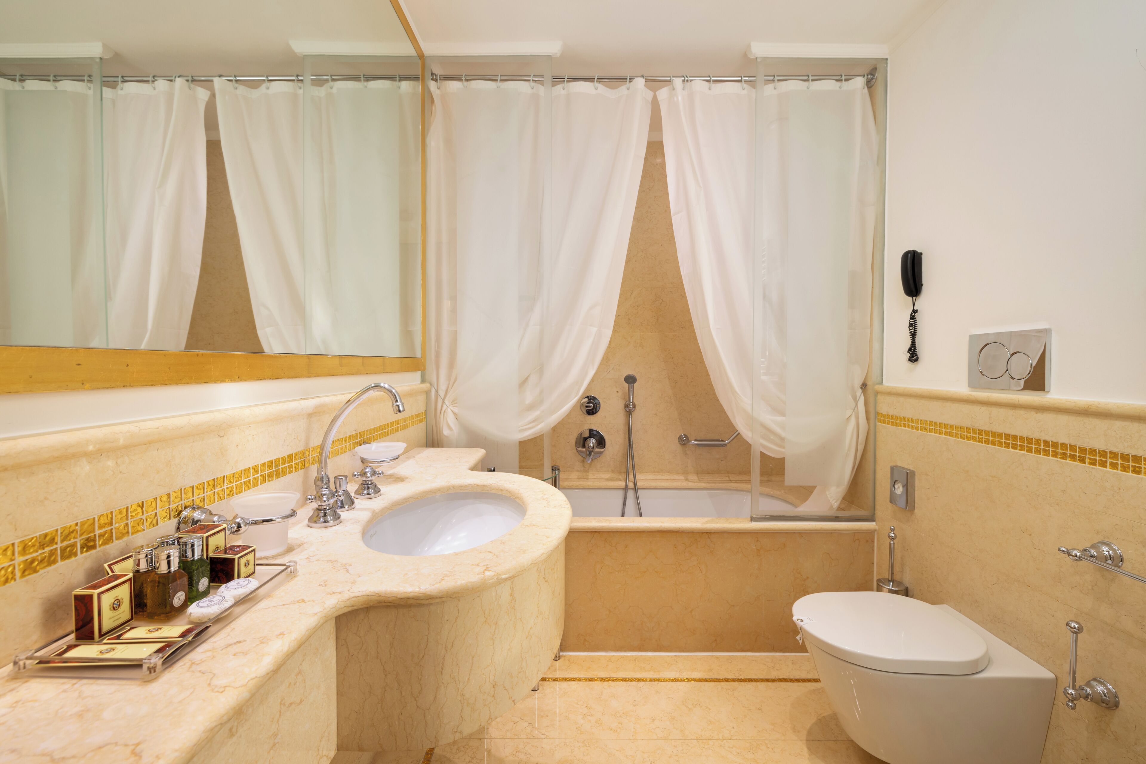 combined shower/bathtub, designer toiletries, hair dryer, bidet