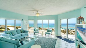 3 Bedrooms Gulf Front Condo, Beach Chairs Included | Living area | TV, DVD player