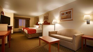 A hotel room with two beds, a sofa, a TV, and a desk. - Best Western Henrietta Inn & Suites (Henrietta)