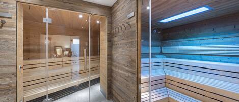 A modern interior with wooden paneling, glass partitions, and a bench area.