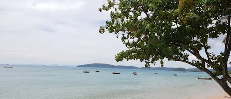 Beach nearby, white sand, beach towels