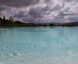 Outdoor pool, open 9:00 AM to 7:00 PM, pool loungers