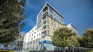 A modern multi-story building with a prominent "Ocean Apartments" sign. - Ocean Serviced Apartments (Edinburgh)