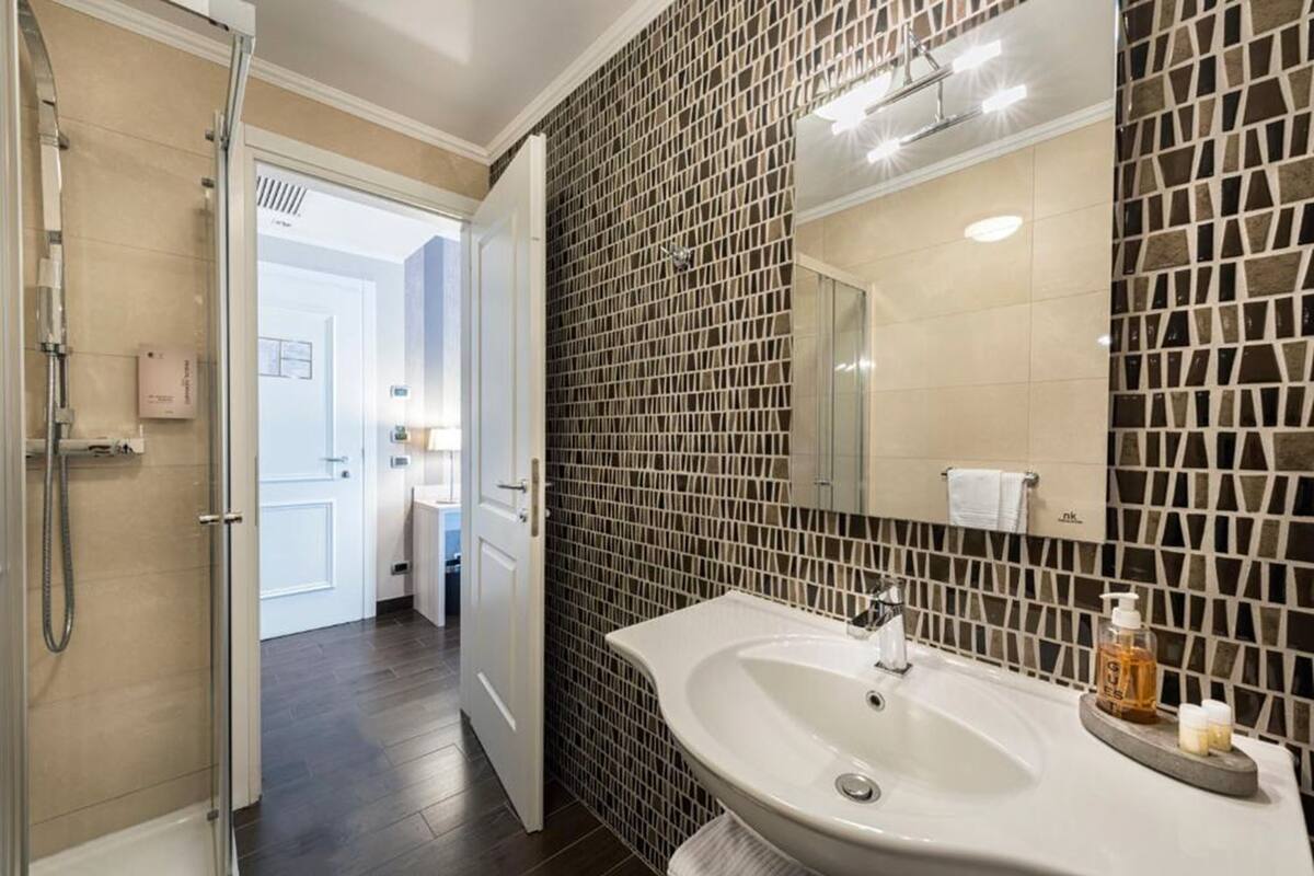 superior double room | bathroom | free toiletries, hair dryer, slippers, towels