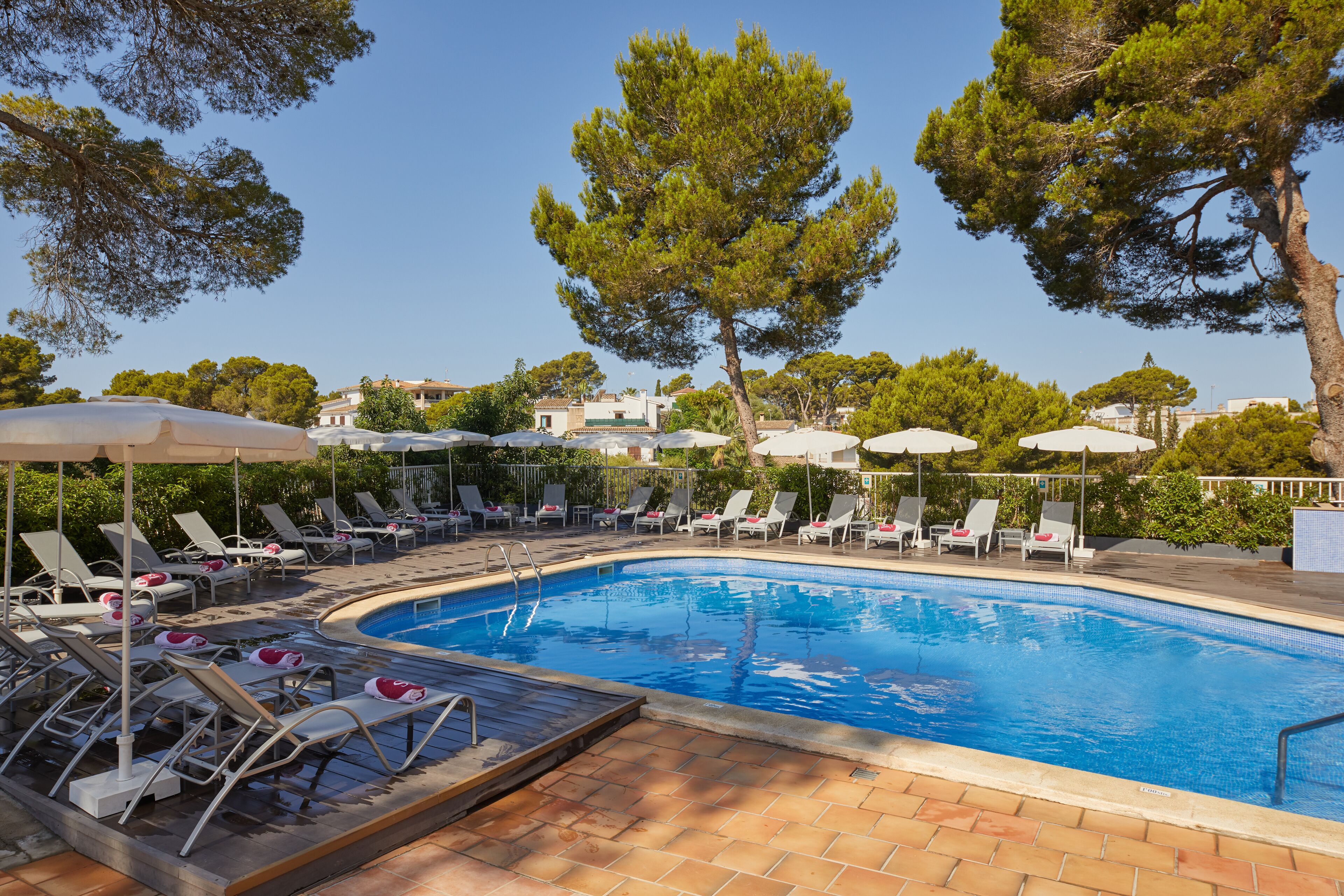 Outdoor pool, open 9:00 AM to 8:00 PM, pool umbrellas, pool loungers