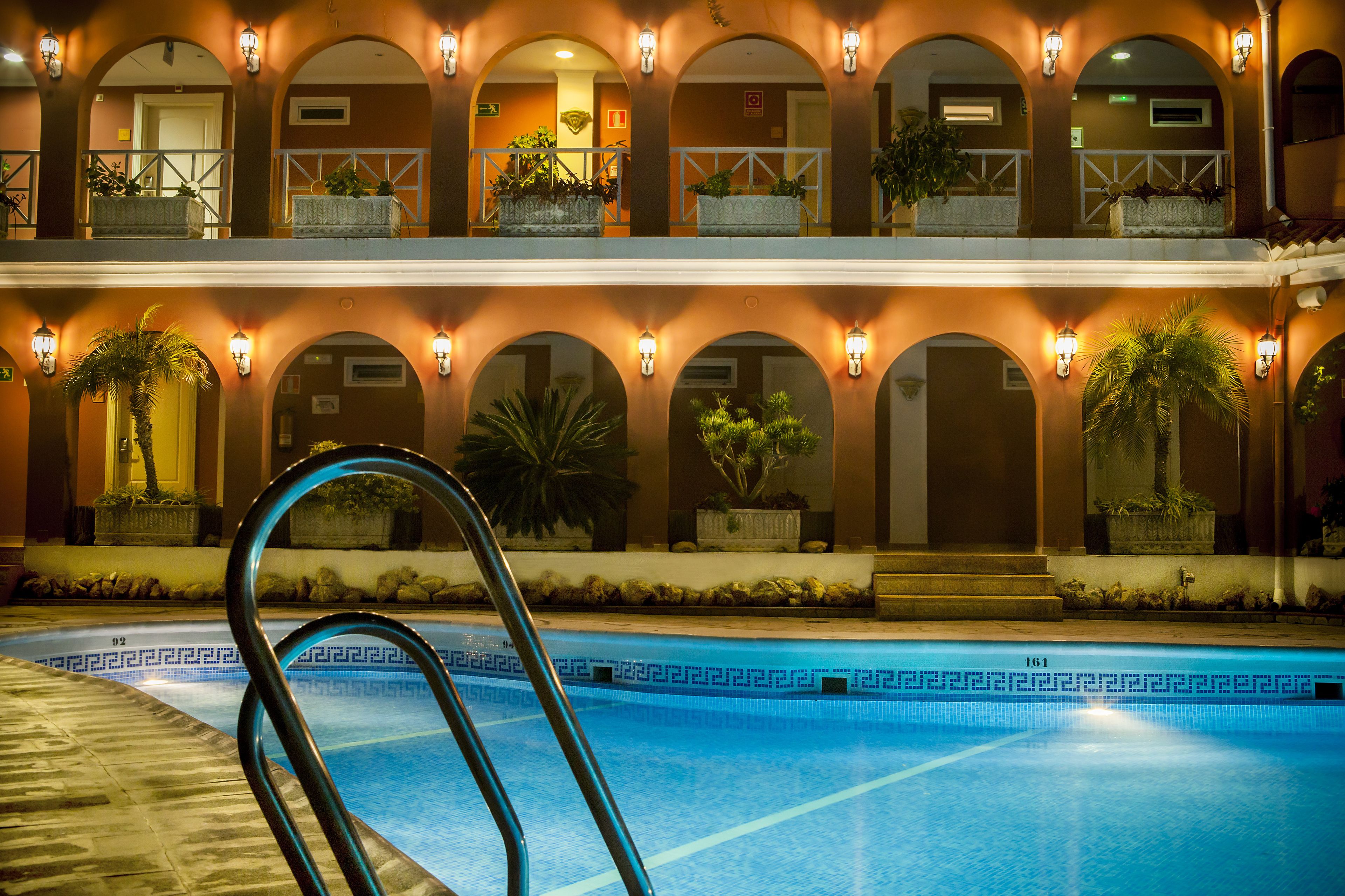 outdoor pool, pool umbrellas, pool loungers