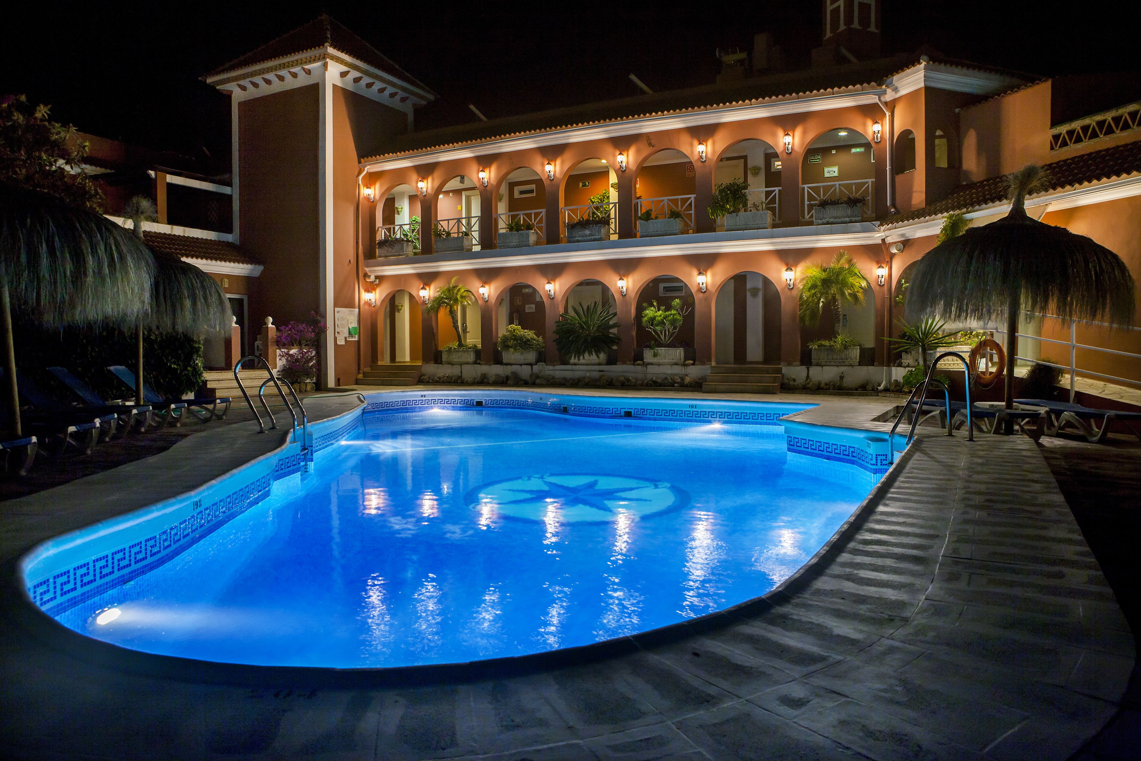 outdoor pool, pool umbrellas, pool loungers