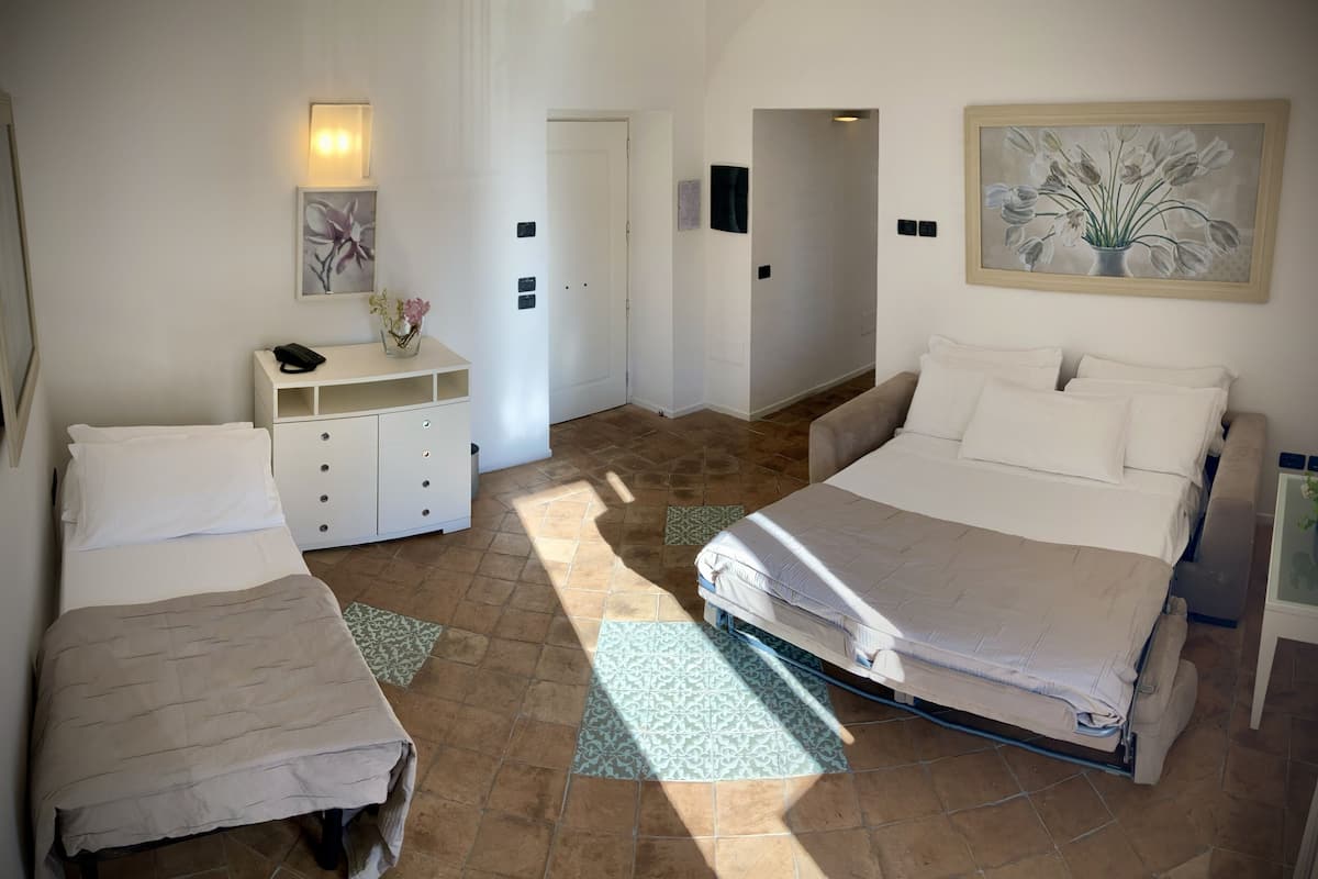 standard quadruple room, multiple beds | down duvets, minibar, in-room safe, desk