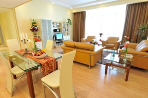 Standard Apartment, 2 Bedrooms | Living room | 32-inch LCD TV with satellite channels, TV, DVD player - One Juffair Luxury Serviced Apartments (Manama)
