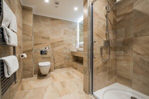 Combined shower/tub, designer toiletries, hair dryer, bathrobes