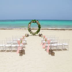 On the beach, white sand, sun loungers, beach towels
