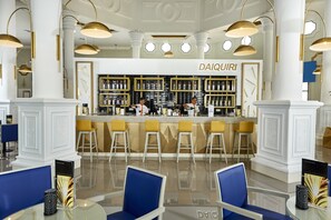 4 bars/lounges, swim-up bar, poolside bar