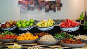 A buffet table with various fruits, vegetables, and salads. - Prima Royale (Jerusalem)