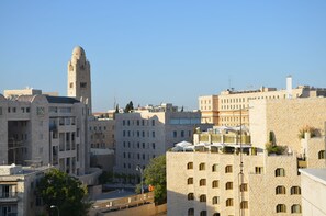 A cityscape with a prominent tower and various buildings.