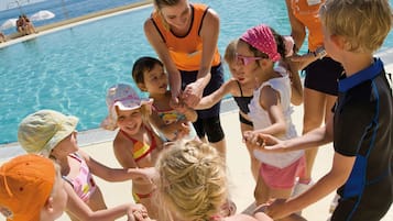 Guests can enjoy a lively poolside atmosphere with a sandy beach and ocean views.
