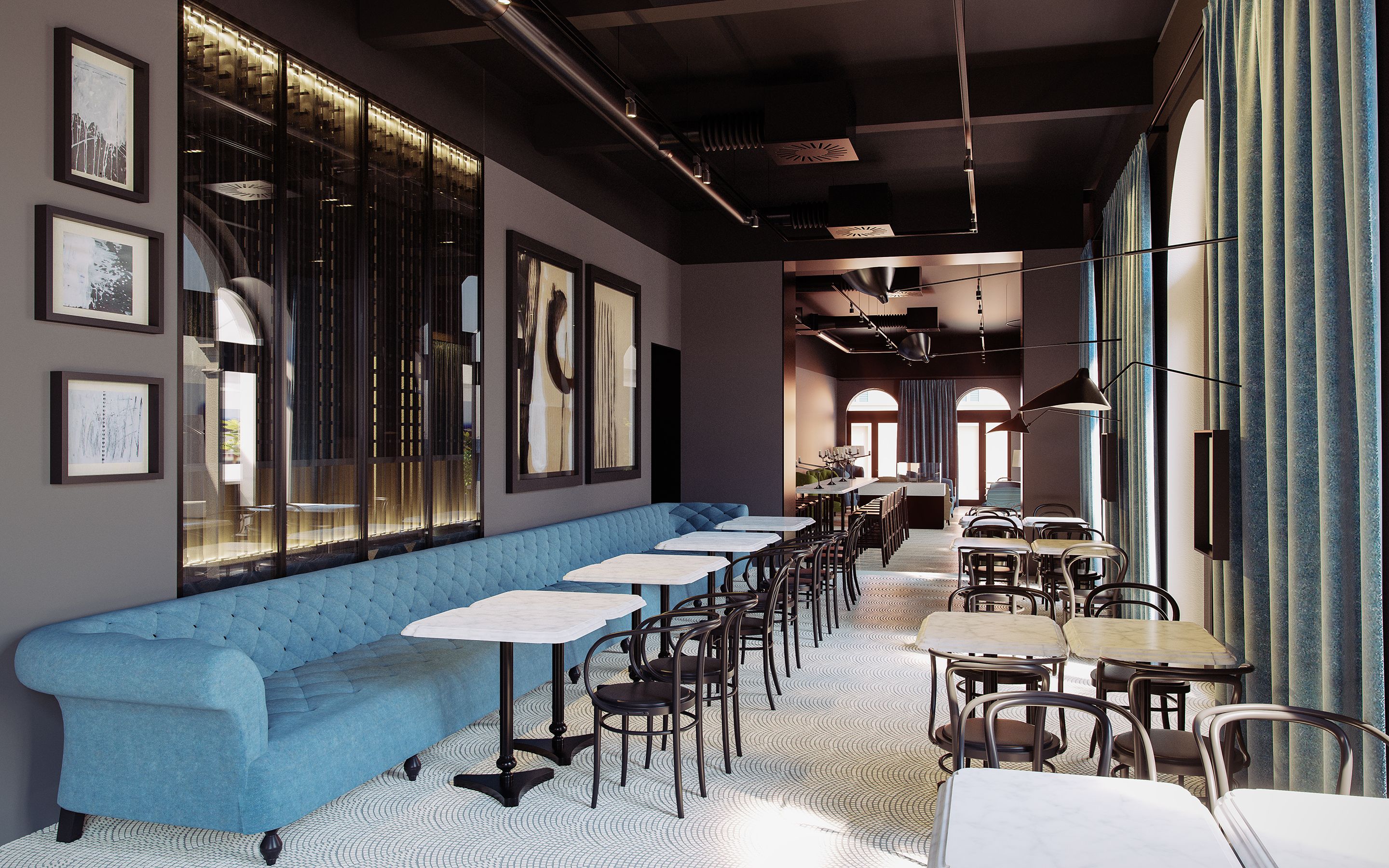 A modern restaurant with a blue upholstered bench, white tables, and black chairs.