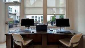 A workspace with two monitors, a printer, and a keyboard. - Residence Inn by Marriott Morgantown Medical Center Area (Morgantown)