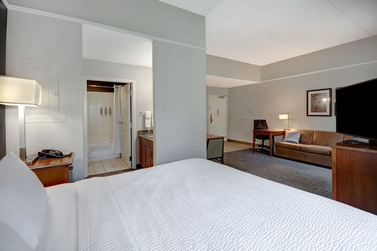 premium bedding, desk, laptop workspace, iron/ironing board