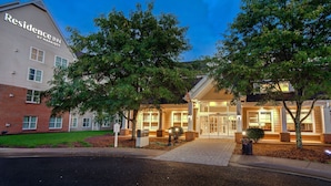 A hotel entrance with a brick facade, large windows, and a well-lit entrance area. - Residence Inn by Marriott Morgantown Medical Center Area (Morgantown)
