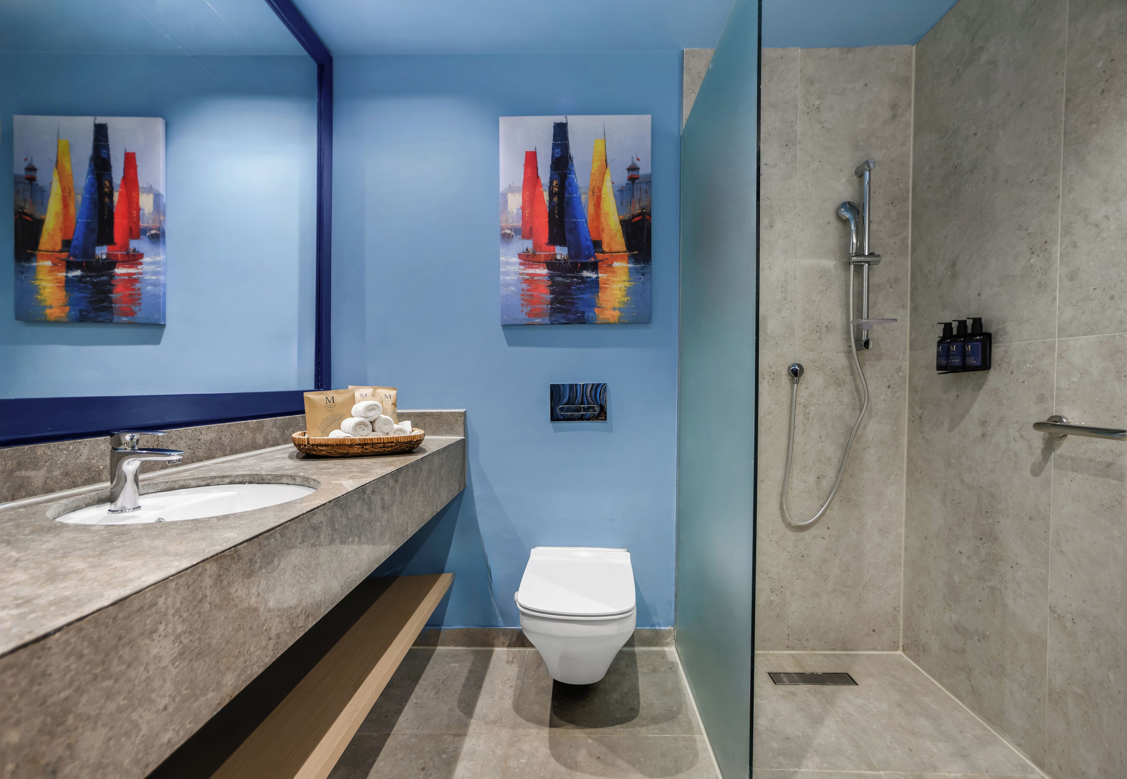 A bathroom with a sink, toilet, and shower.