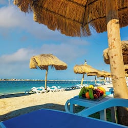 Private beach, white sand, beach umbrellas, motor boating