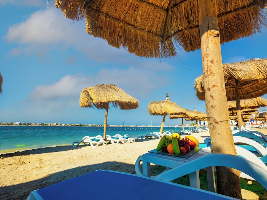 Private beach, white sand, beach umbrellas, motor boating