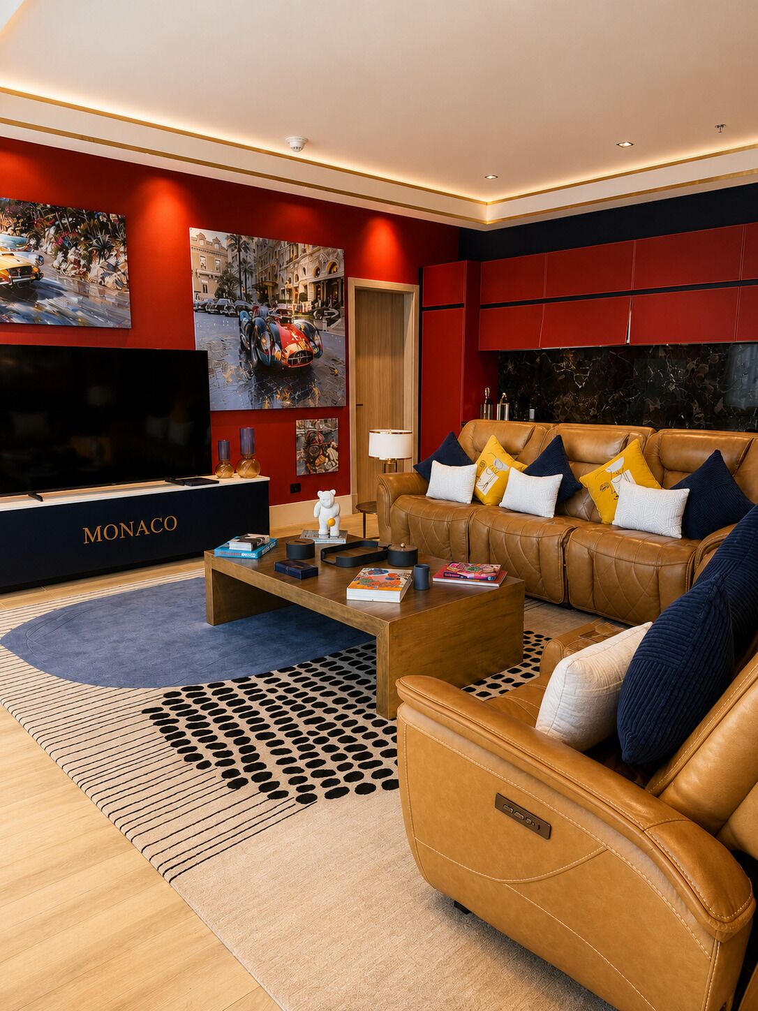 A modern living room with a leather sofa, a flat-screen TV, and artwork on the walls.