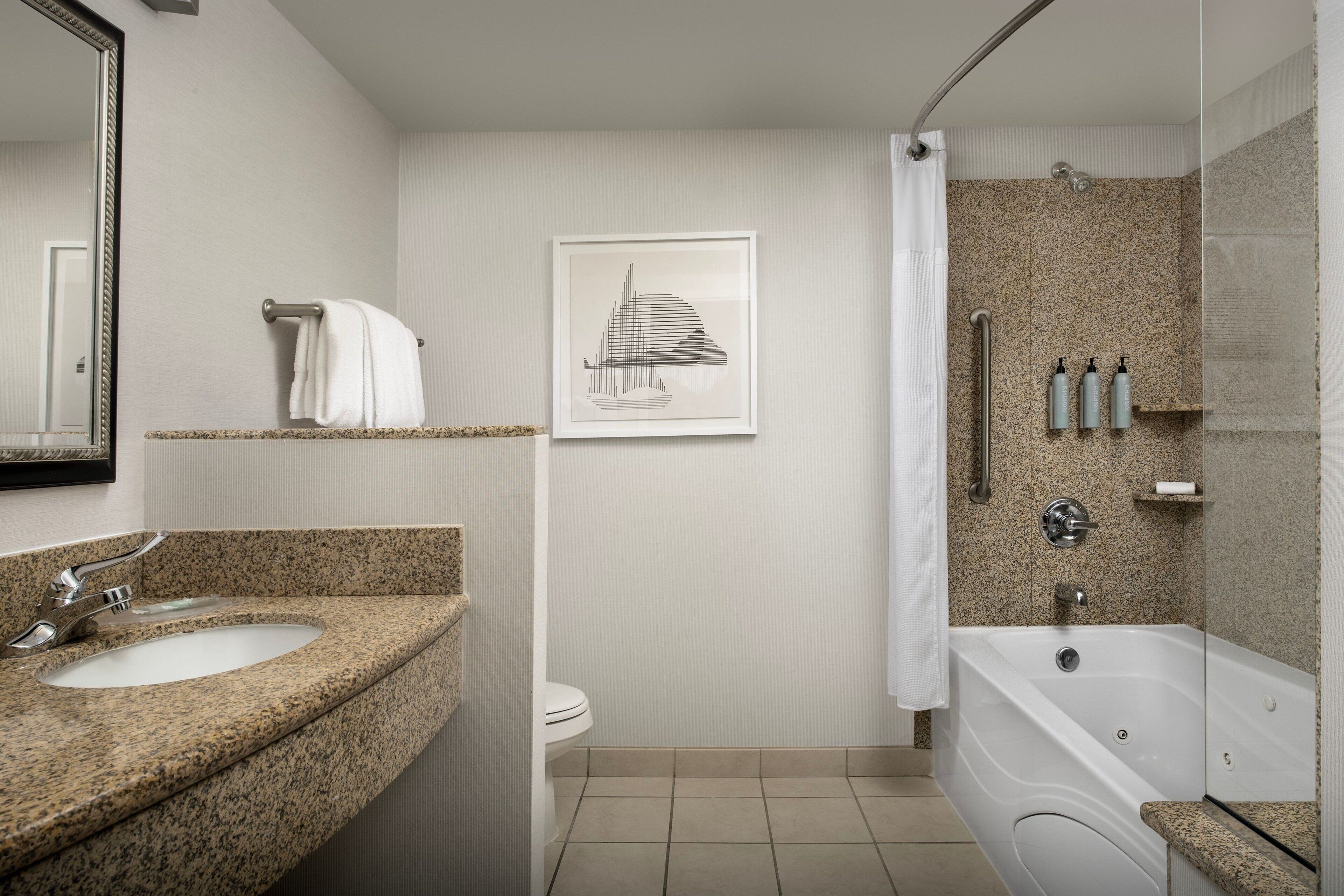 suite, 1 bedroom | bathroom | combined shower/bathtub, rainfall showerhead, free toiletries