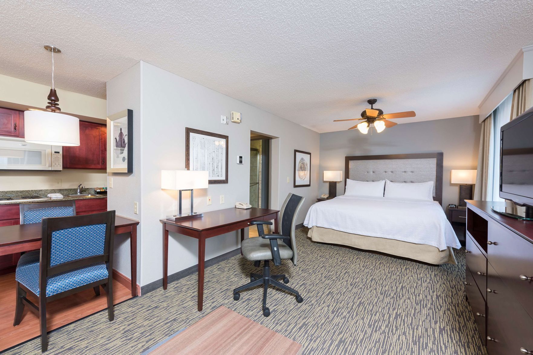Premium bedding, pillow-top beds, desk, laptop workspace