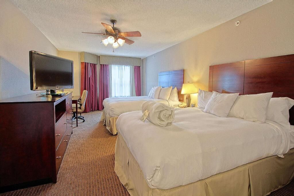 Premium bedding, pillow-top beds, desk, laptop workspace