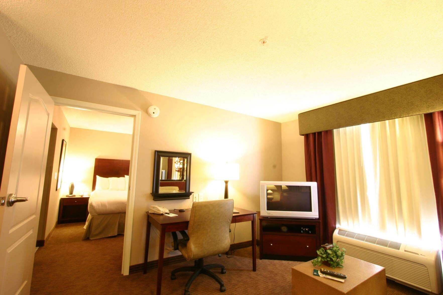 Premium bedding, pillow-top beds, desk, laptop workspace