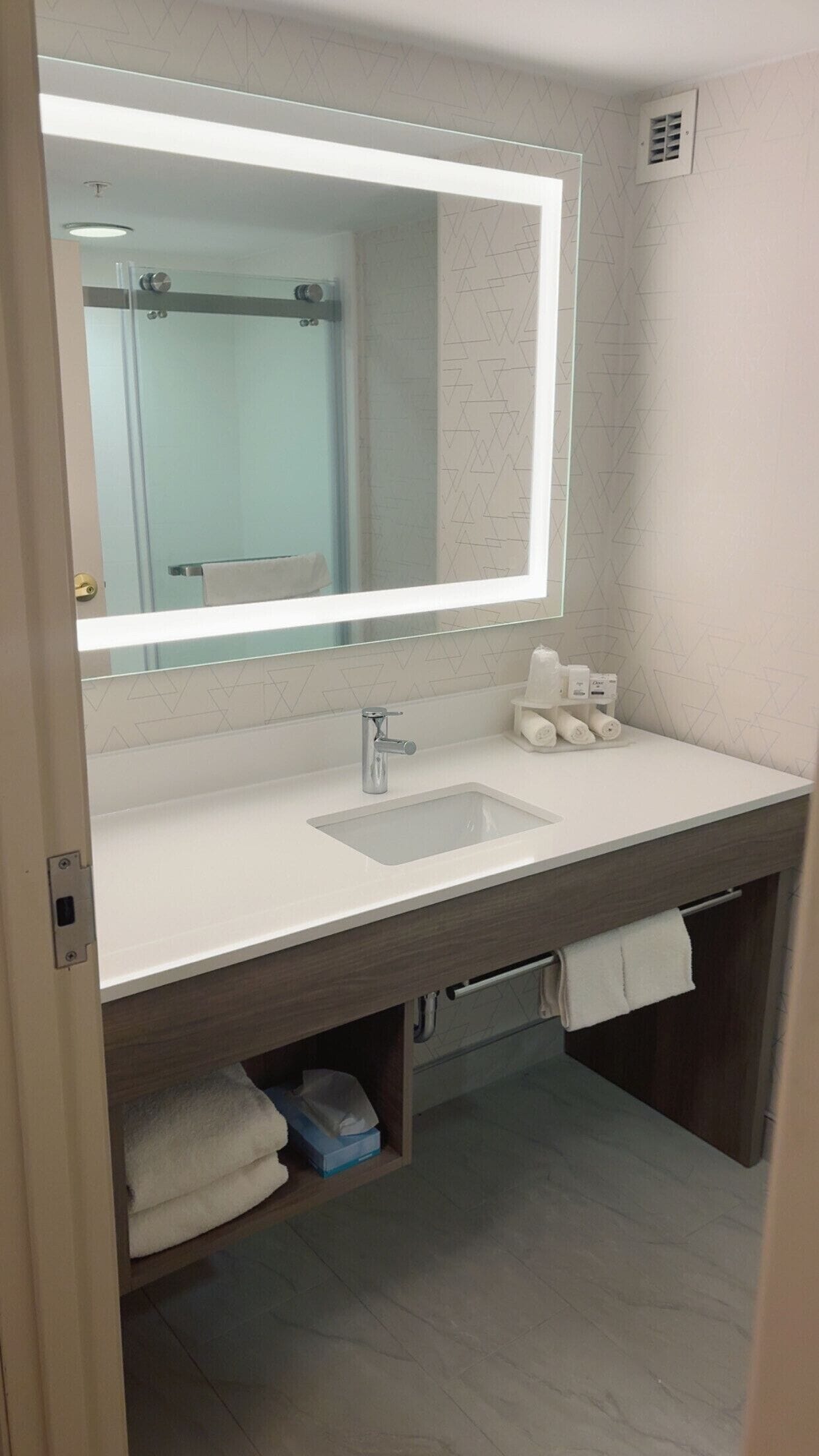 combined shower/bathtub, hair dryer, towels, soap